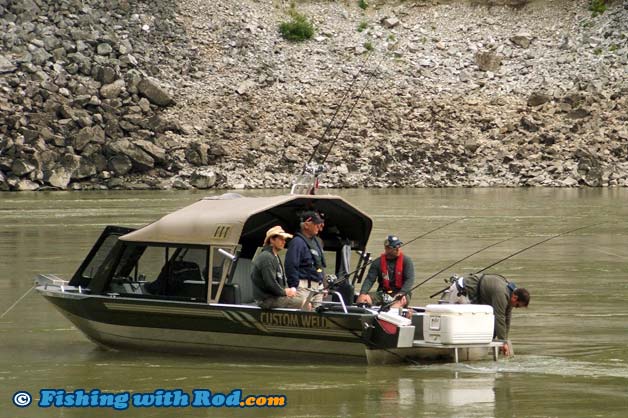 Fraser River white sturgeon fishing from a jet boat.